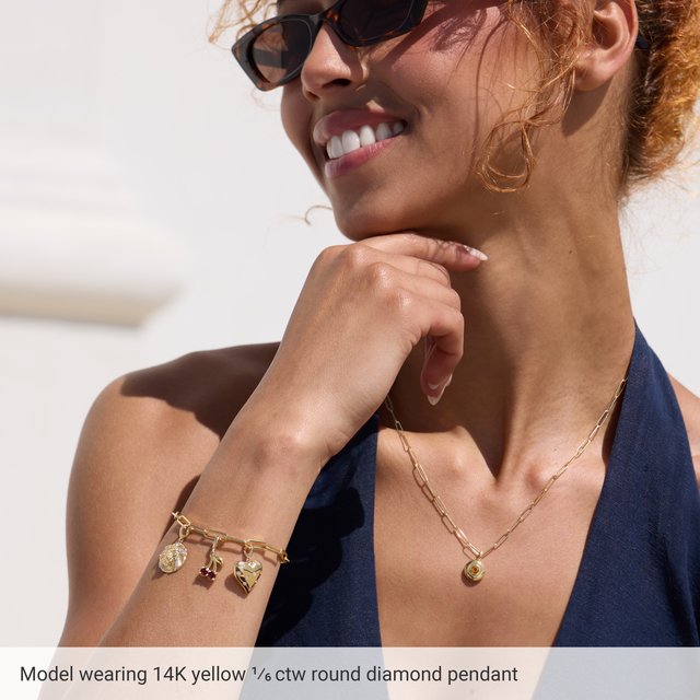 
                  
                    14K Yellow 1/6 CTW Natural Diamond Puffy Heart Charm/Pendant
                  
                