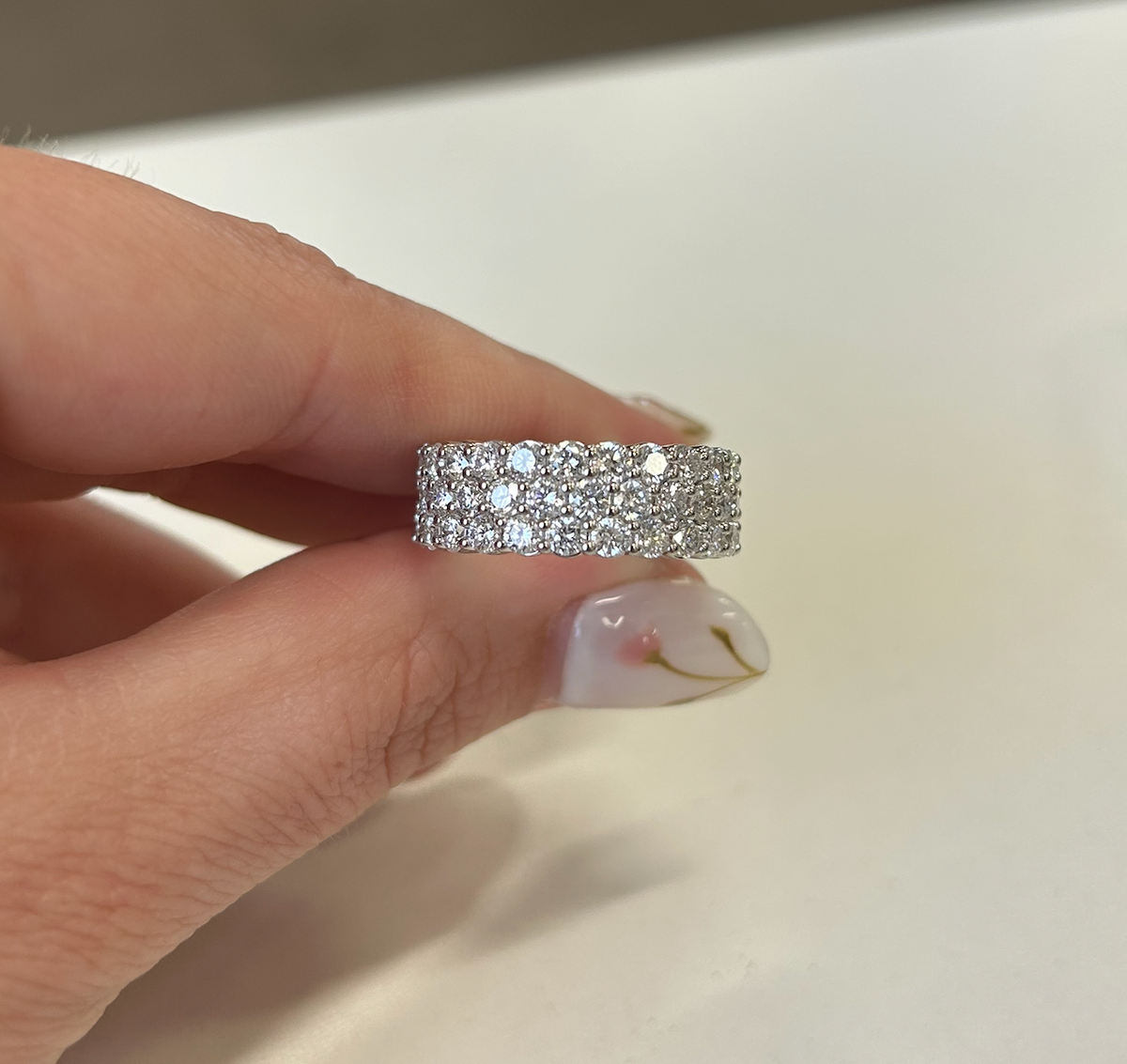 Wide diamond anniversary band with three rows of stones